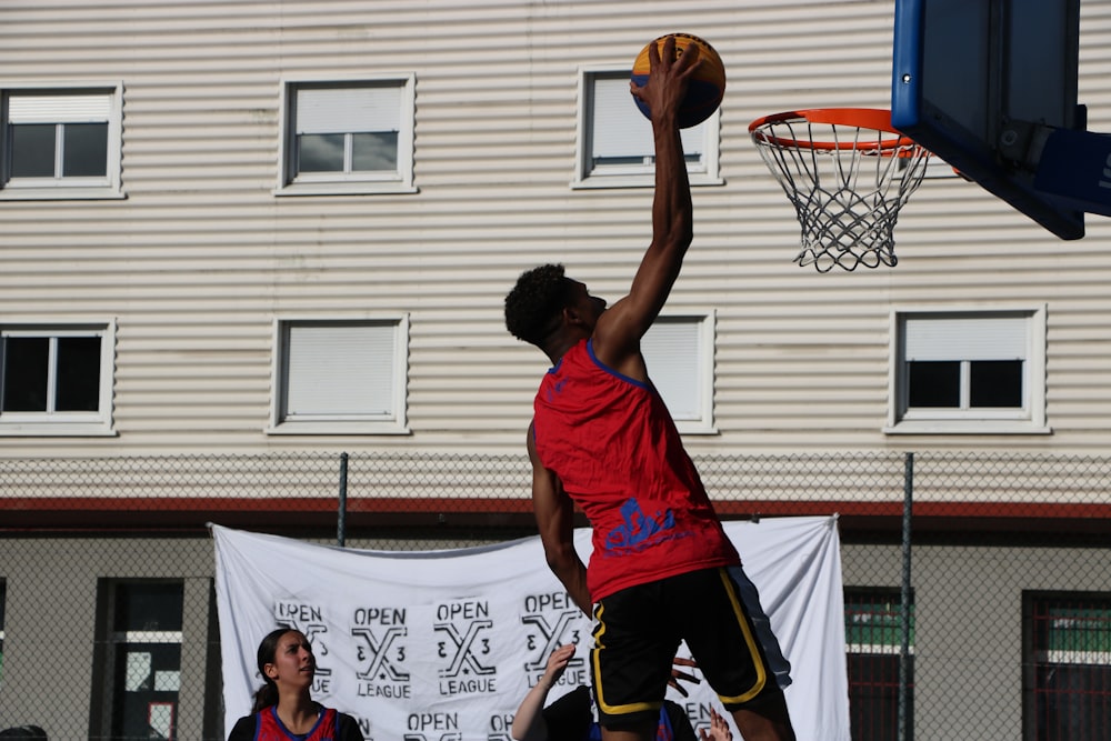 a person dunking a basketball