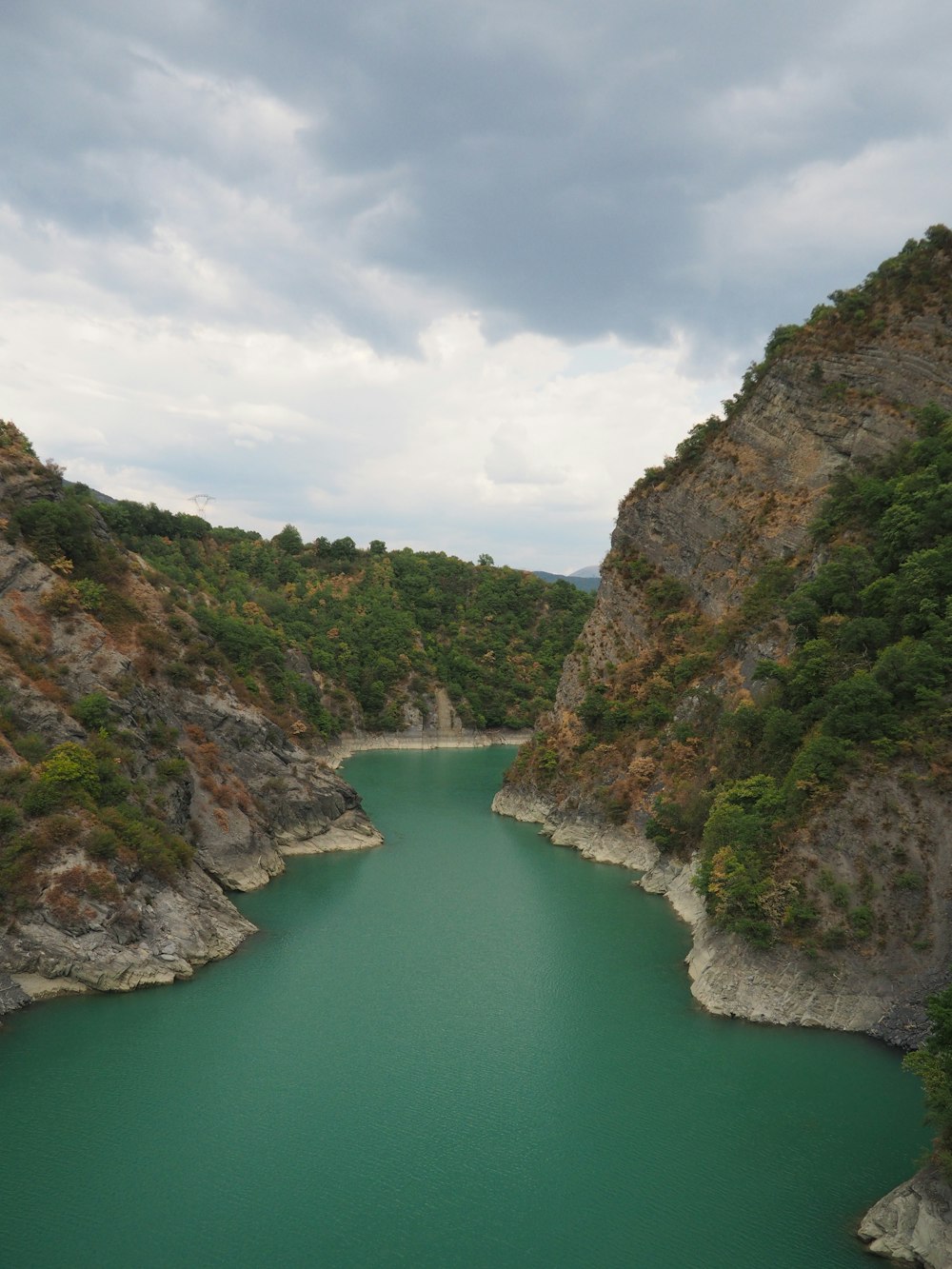 a river with a rocky shoreline