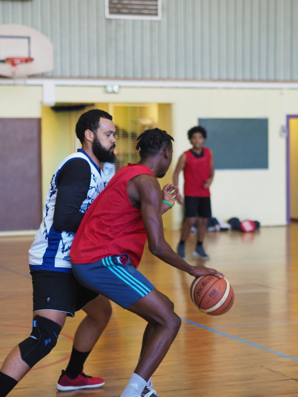 a group of men playing basketball