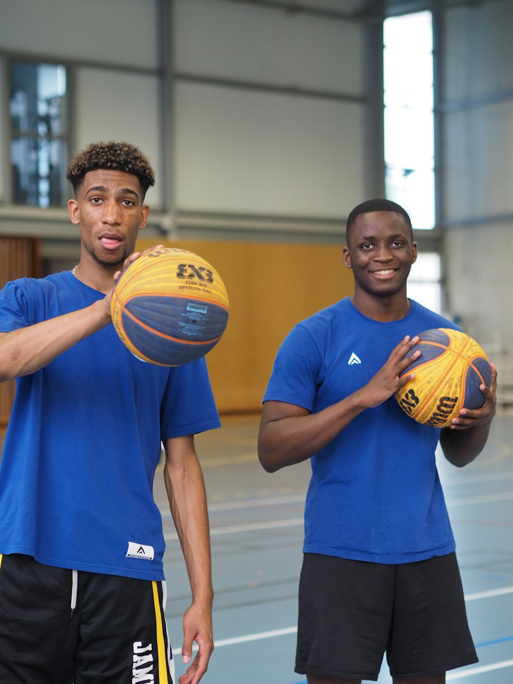 a couple of men holding a ball