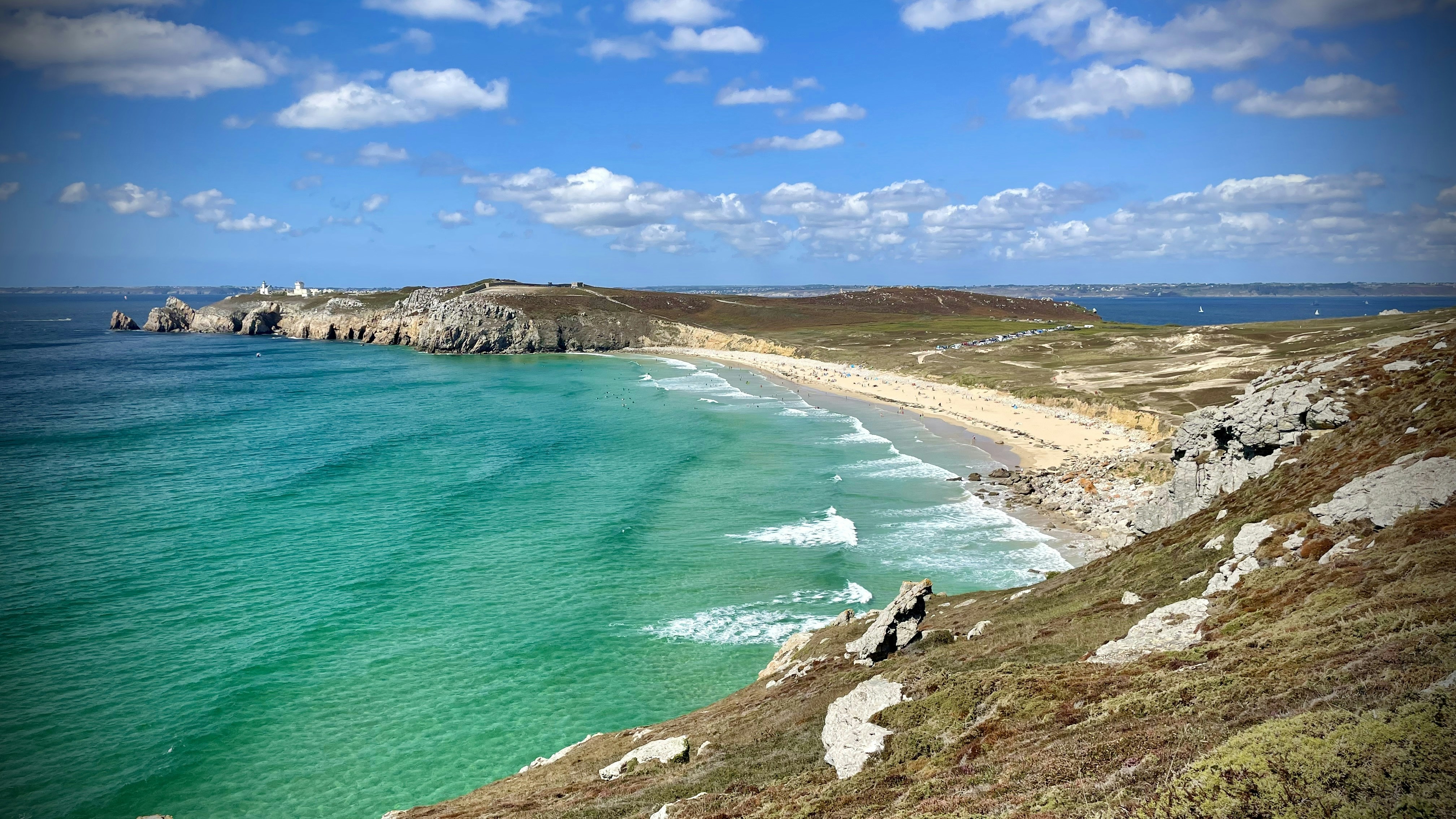a beach with blue water