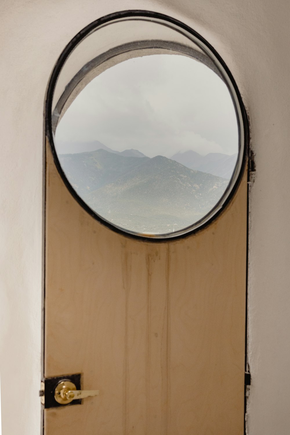 a door with a view of mountains