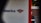 A partial view of a sign, displaying a recognizable red, white, and blue logo. The words 'of America' are visible, suggesting it is associated with a financial institution. The background shows a building with a brick facade.