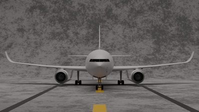 a white airplane on a runway