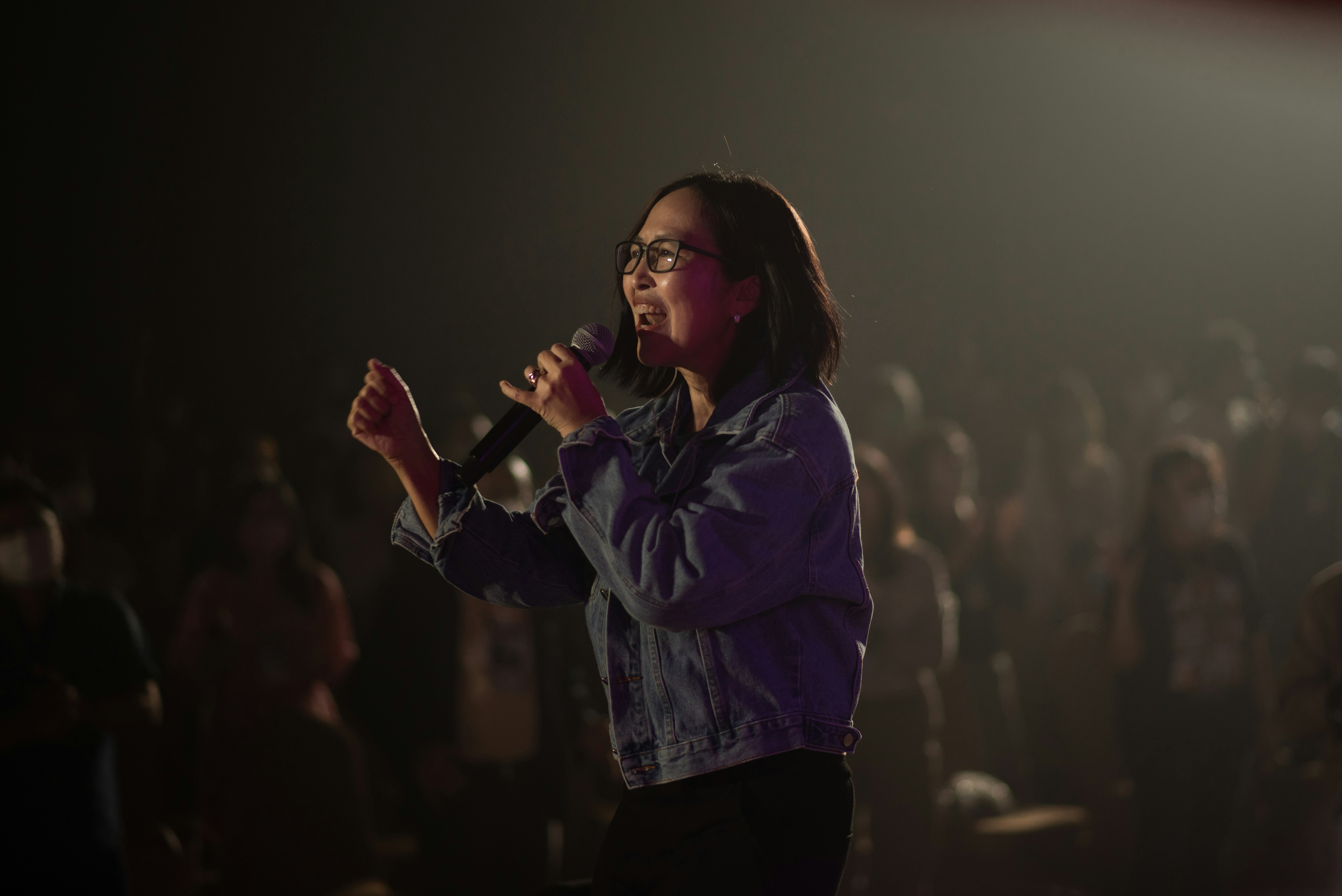 a person singing into a microphone