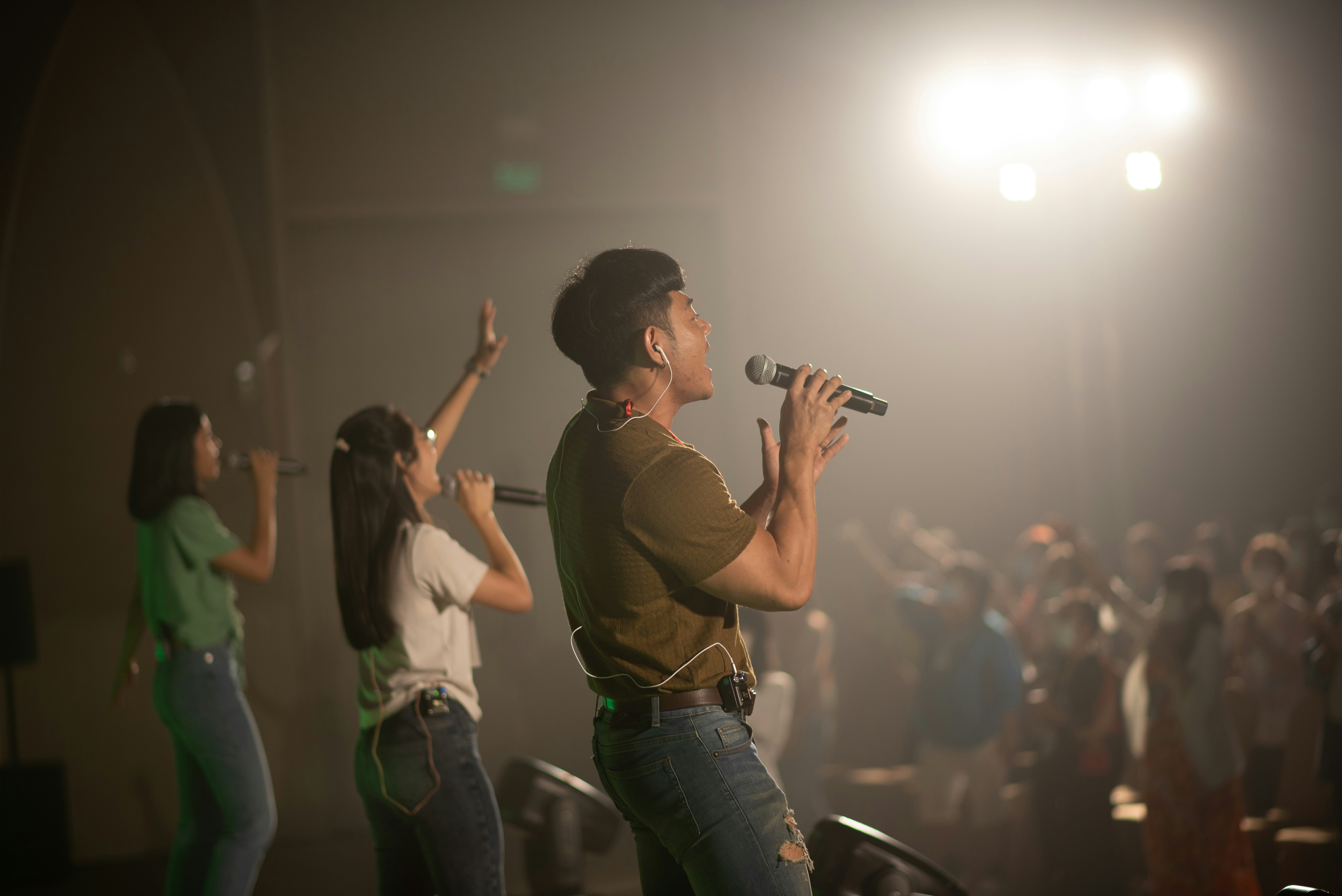 a woman singing into a microphone