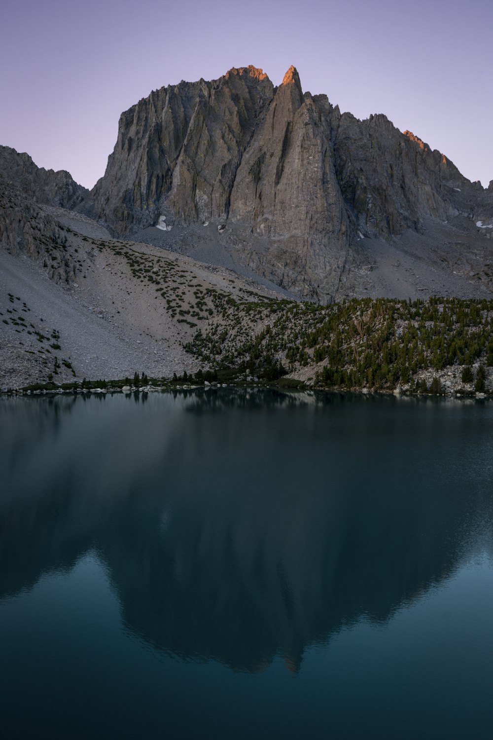 a lake with a mountain in the background