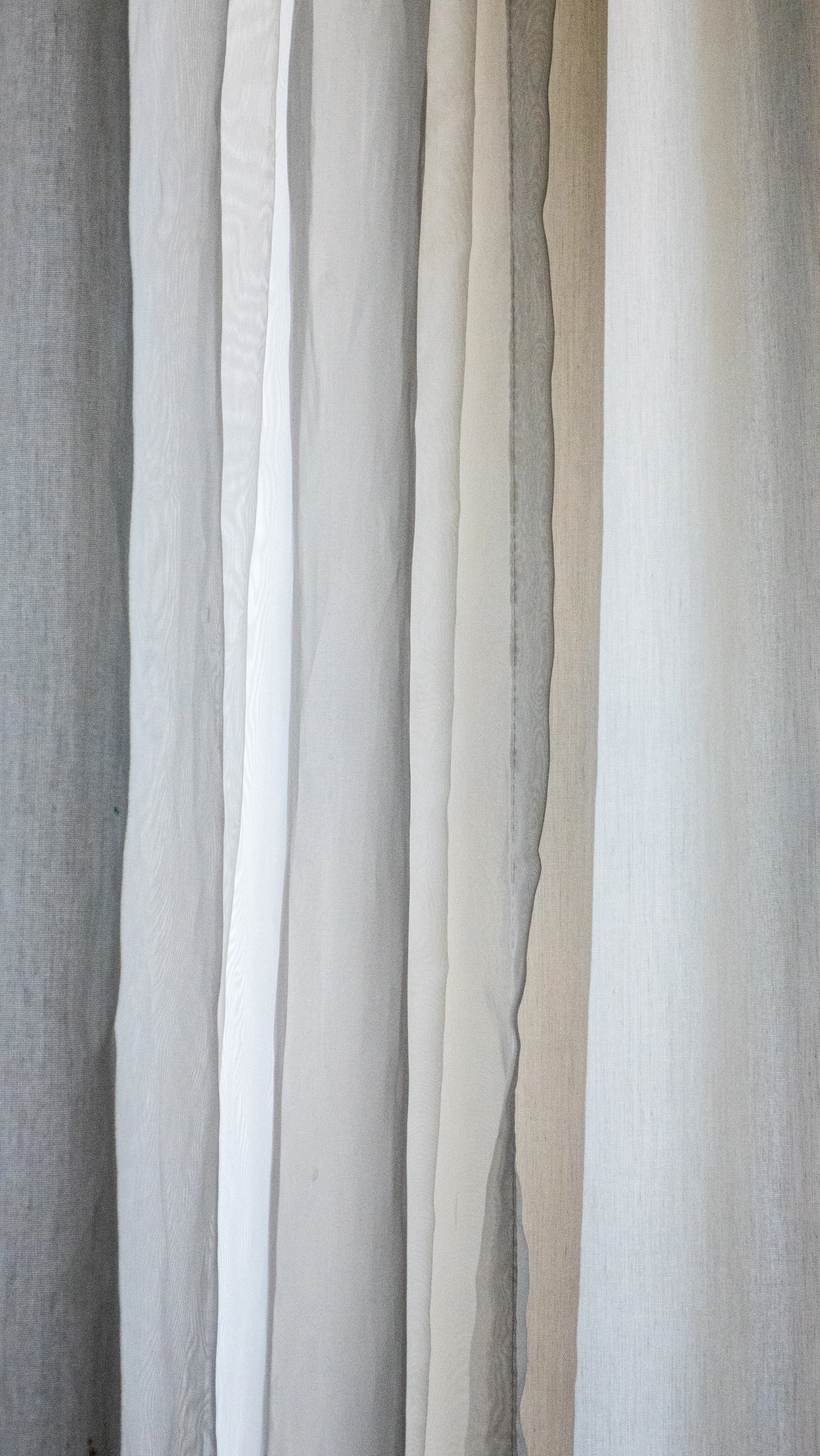 a white wall with a brown line