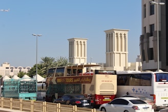 a group of cars and buses in a city
