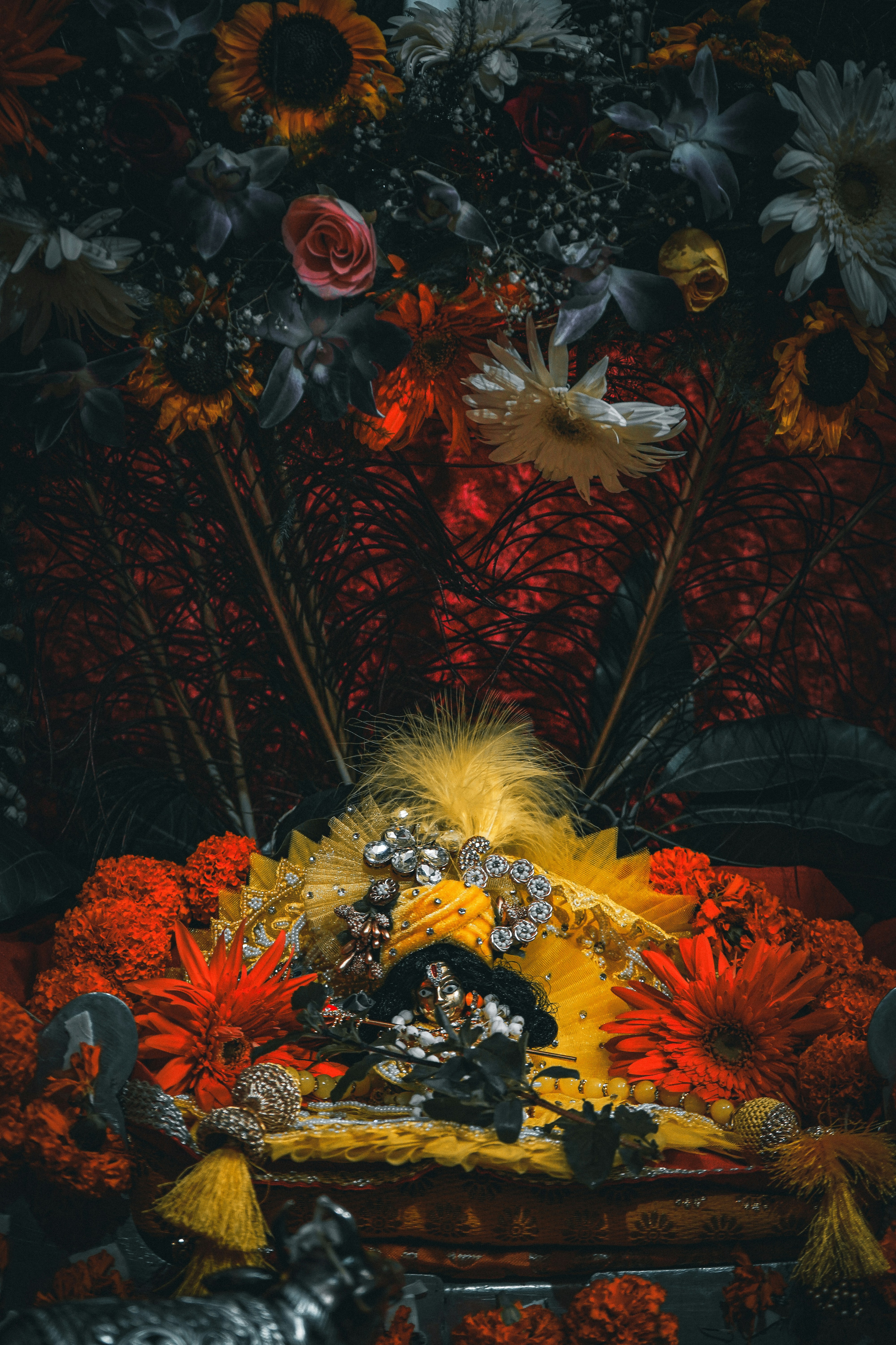 a painting of a man on a throne with flowers and a woman on top of it