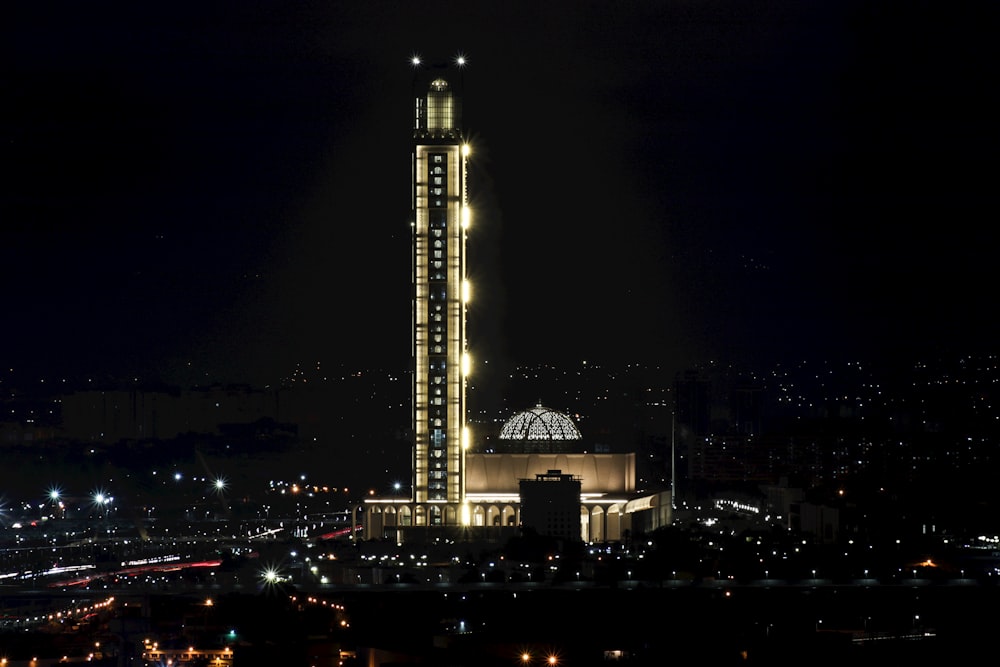 a tall building with lights at night