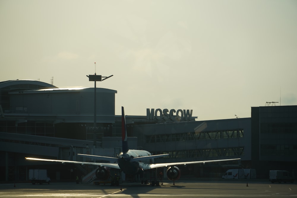 an airplane is parked at an airport