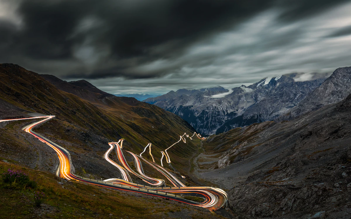 Stelvio Pass hairpin roads at night from above
