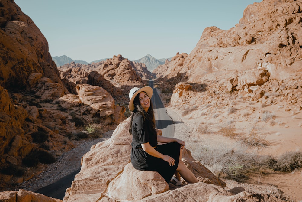 a man sitting on a rock