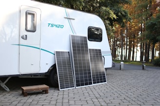 a white trailer with a solar panel