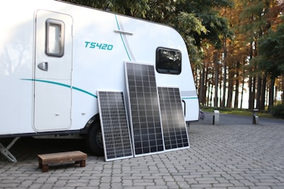 a white trailer with a solar panel