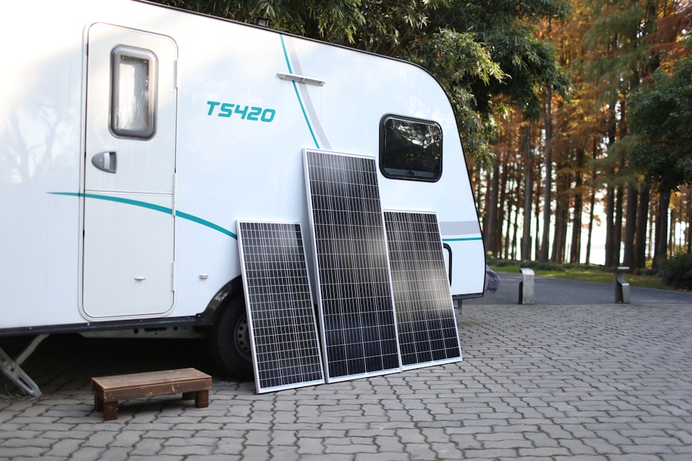 a white trailer with a solar panel