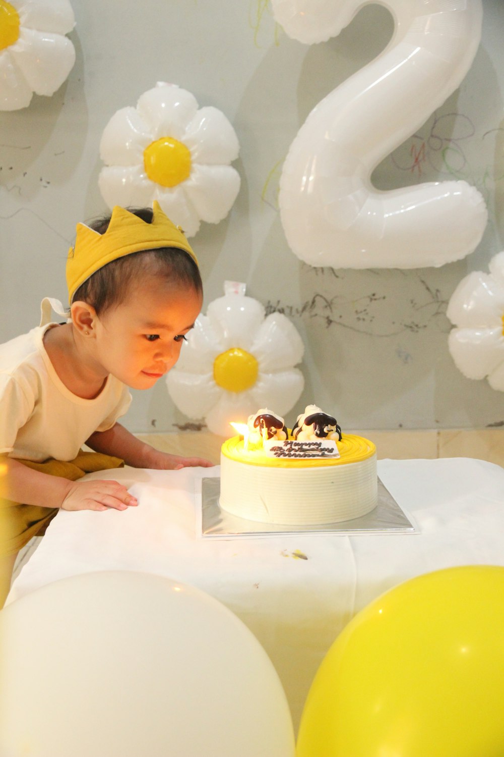 a baby looking at a cake