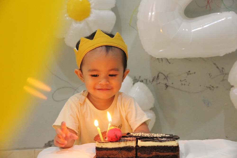 a boy with a birthday cake