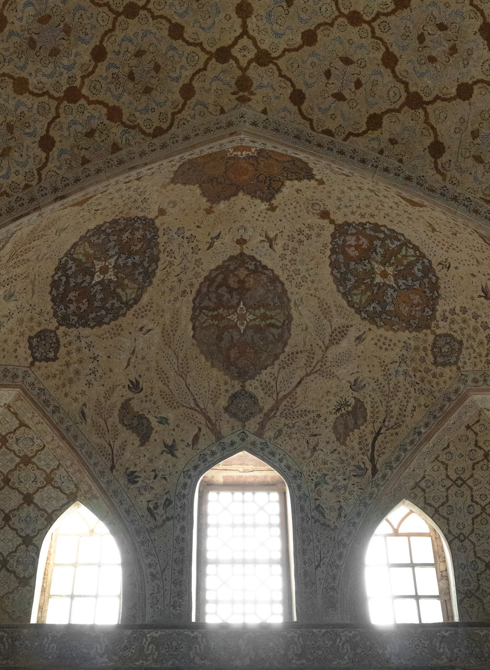 a ceiling with windows and a ceiling with arched windows