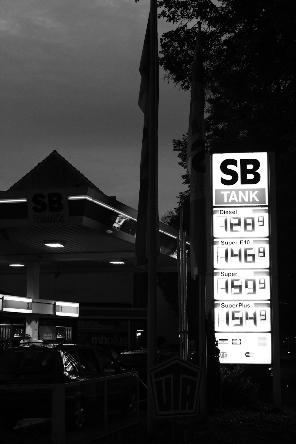 a gas station with a sign