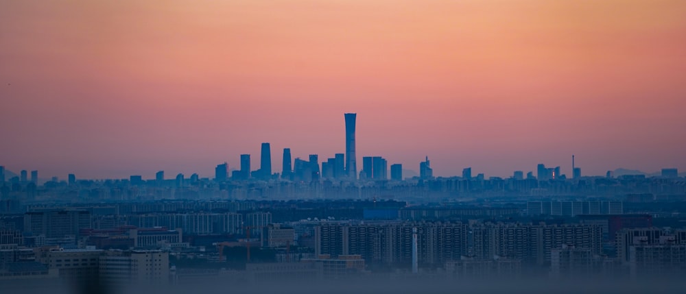 a city skyline at sunset