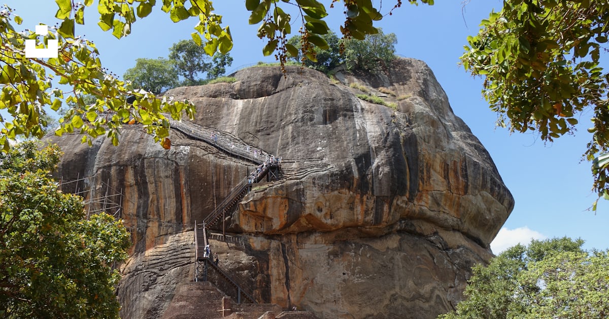 A large rock formation with people around it photo – Free Sri lanka ...