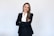 a woman in a black suit