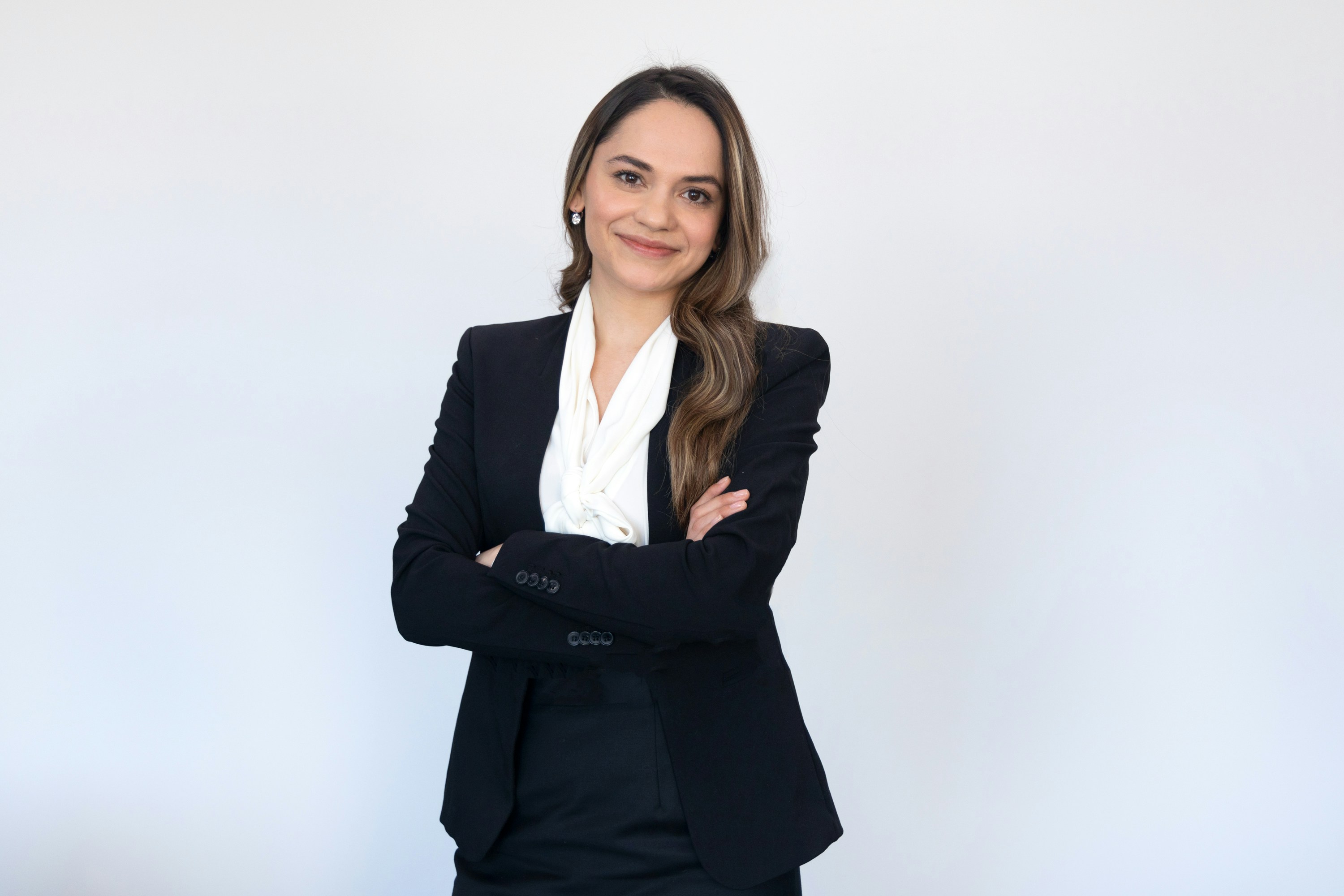 Beautiful Female Lawyer Smiling.Confidently standing with arms crossed

