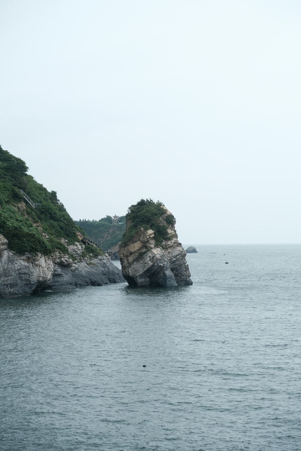 a rocky cliff in the water