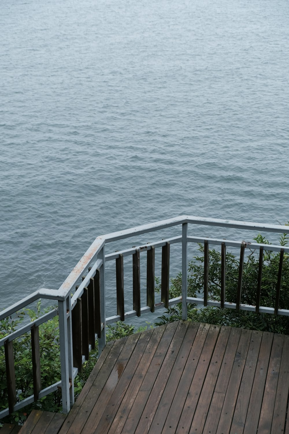 a wooden deck overlooking a body of water