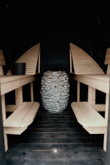 a wooden table with chairs and a drum set