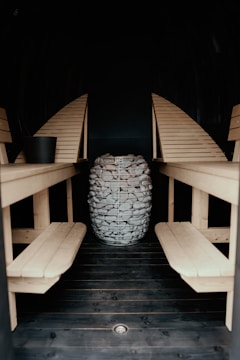 a wooden table with chairs and a drum set