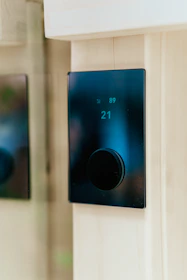 Close-up of a heating system control panel in a cozy home environment.