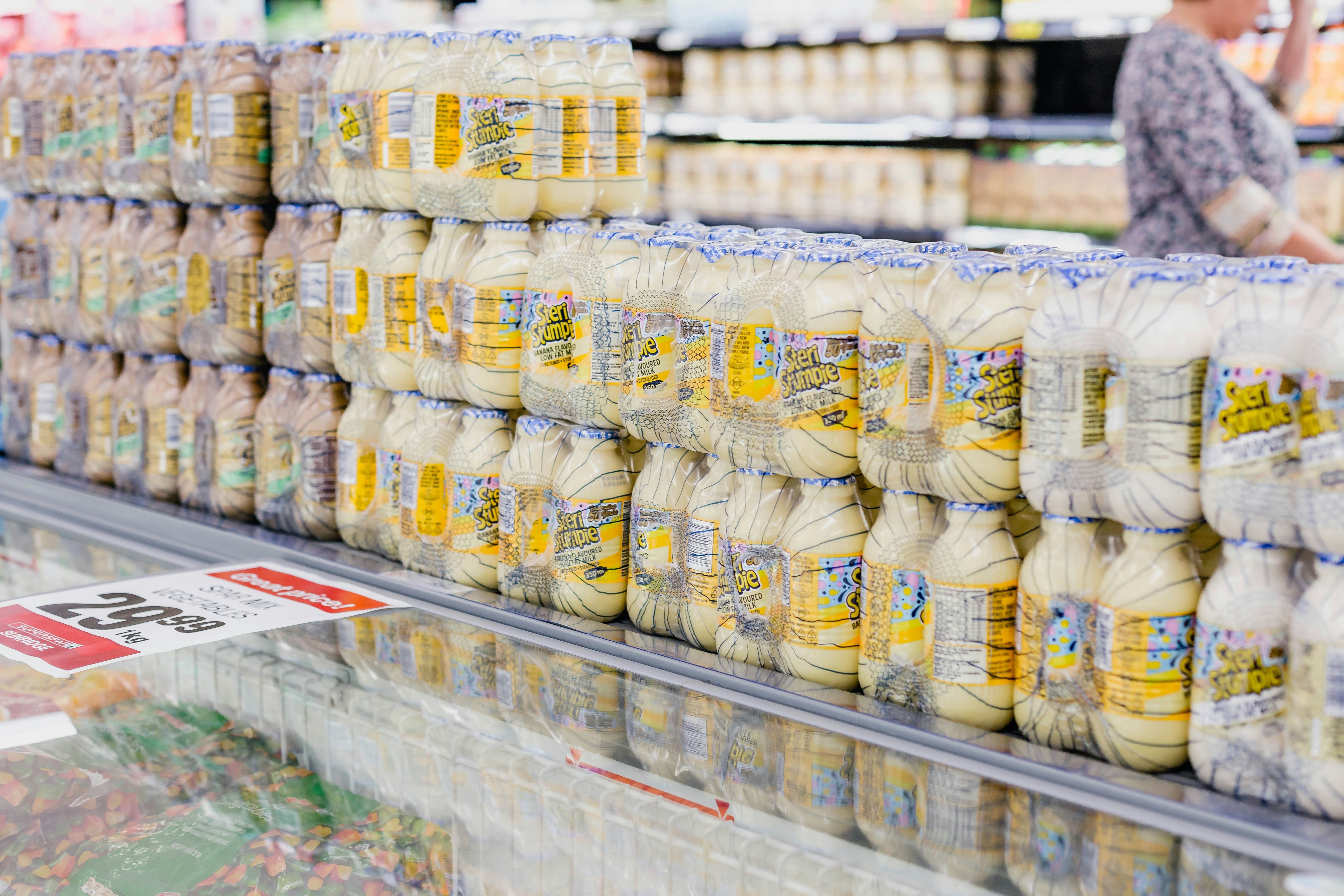 Supermarket shelves stocked with packaged groceries