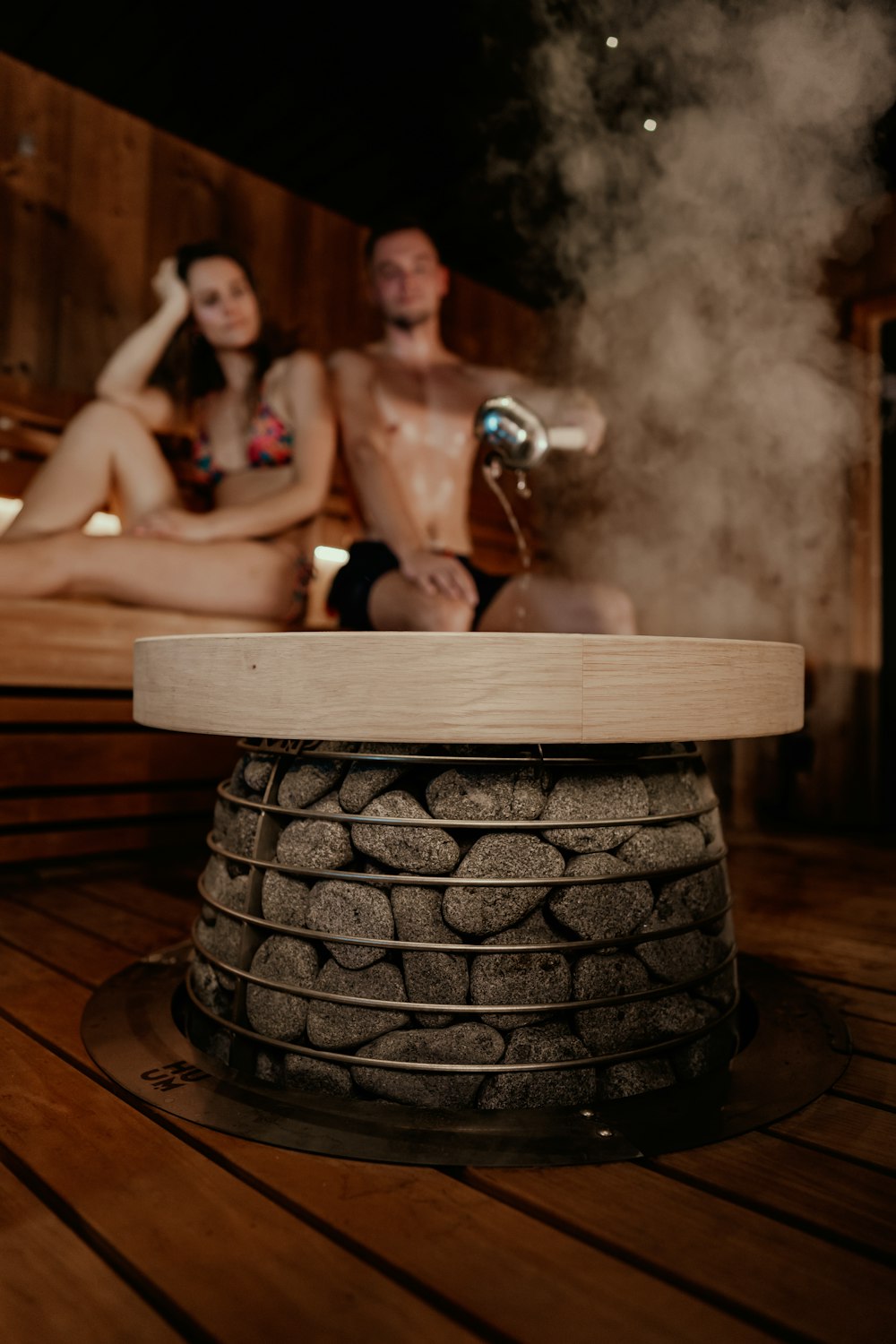 a man and woman in a bathtub with a large tub of water