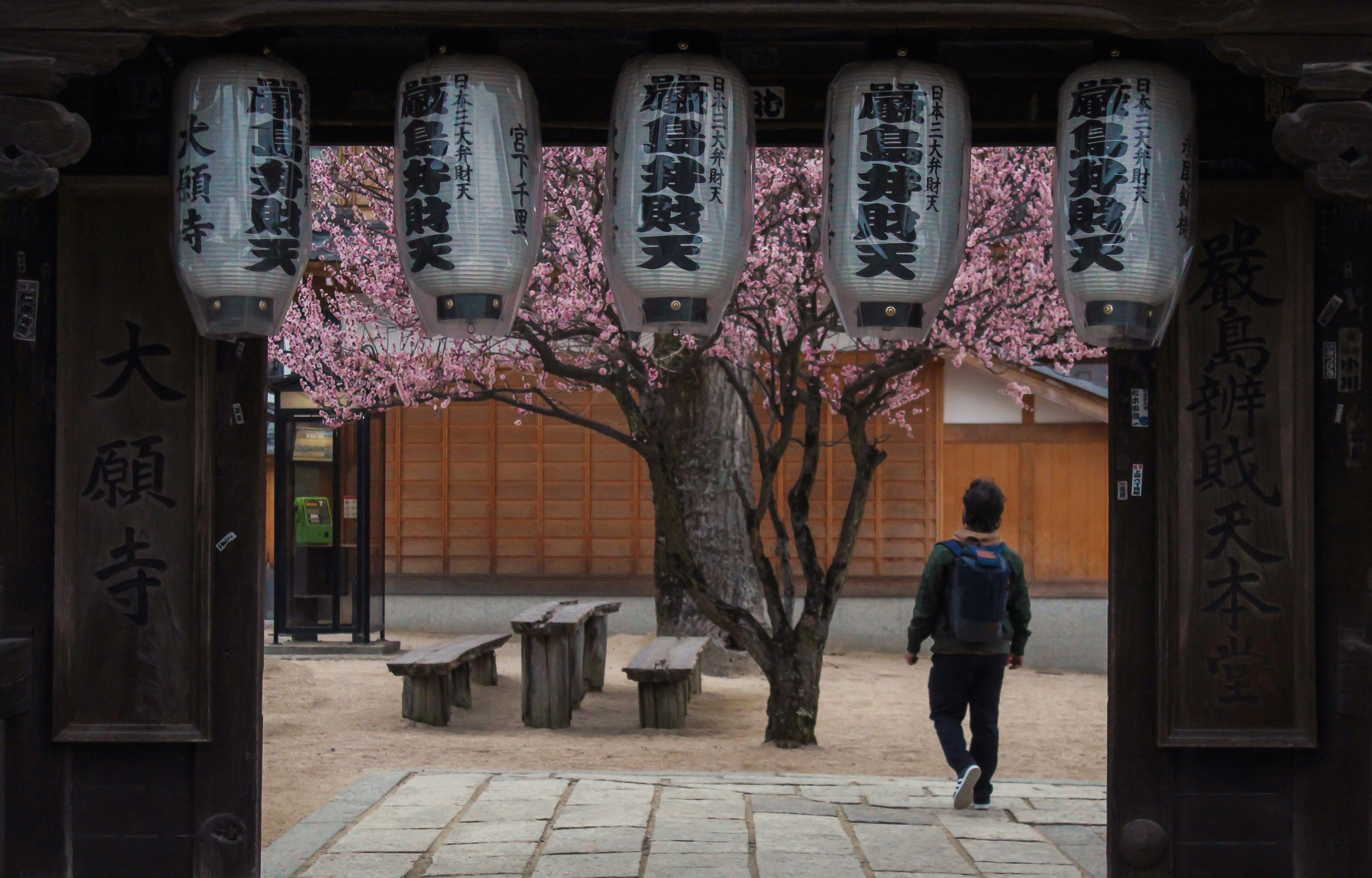 a person walking in a courtyard