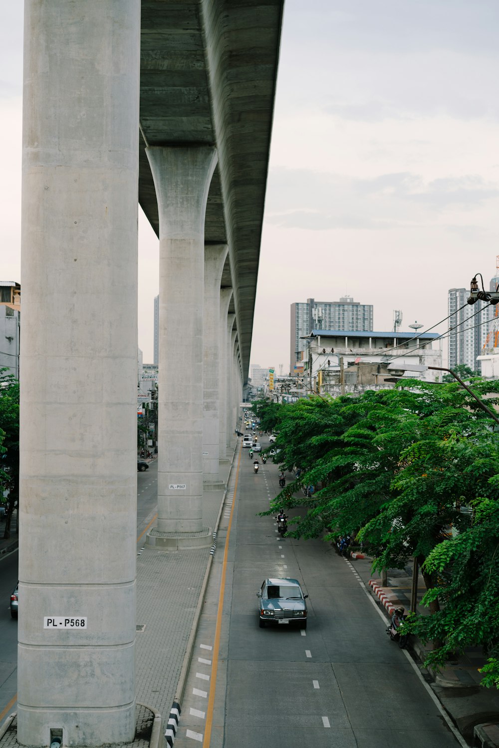 a car driving under a bridge