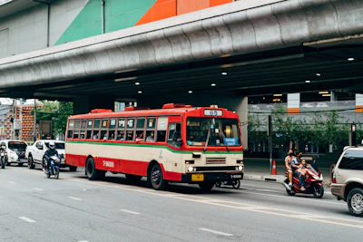 a bus travels under a bridge