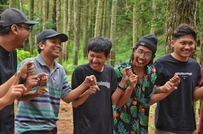 A group of men sharing experiences in a supportive circle outdoors.