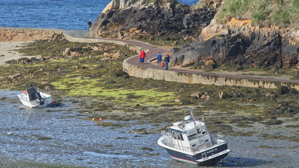 a boat is parked on the shore