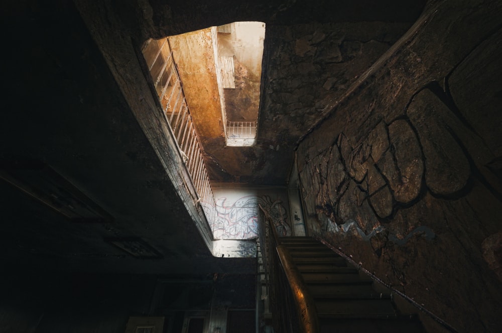 a staircase in a dark stone building