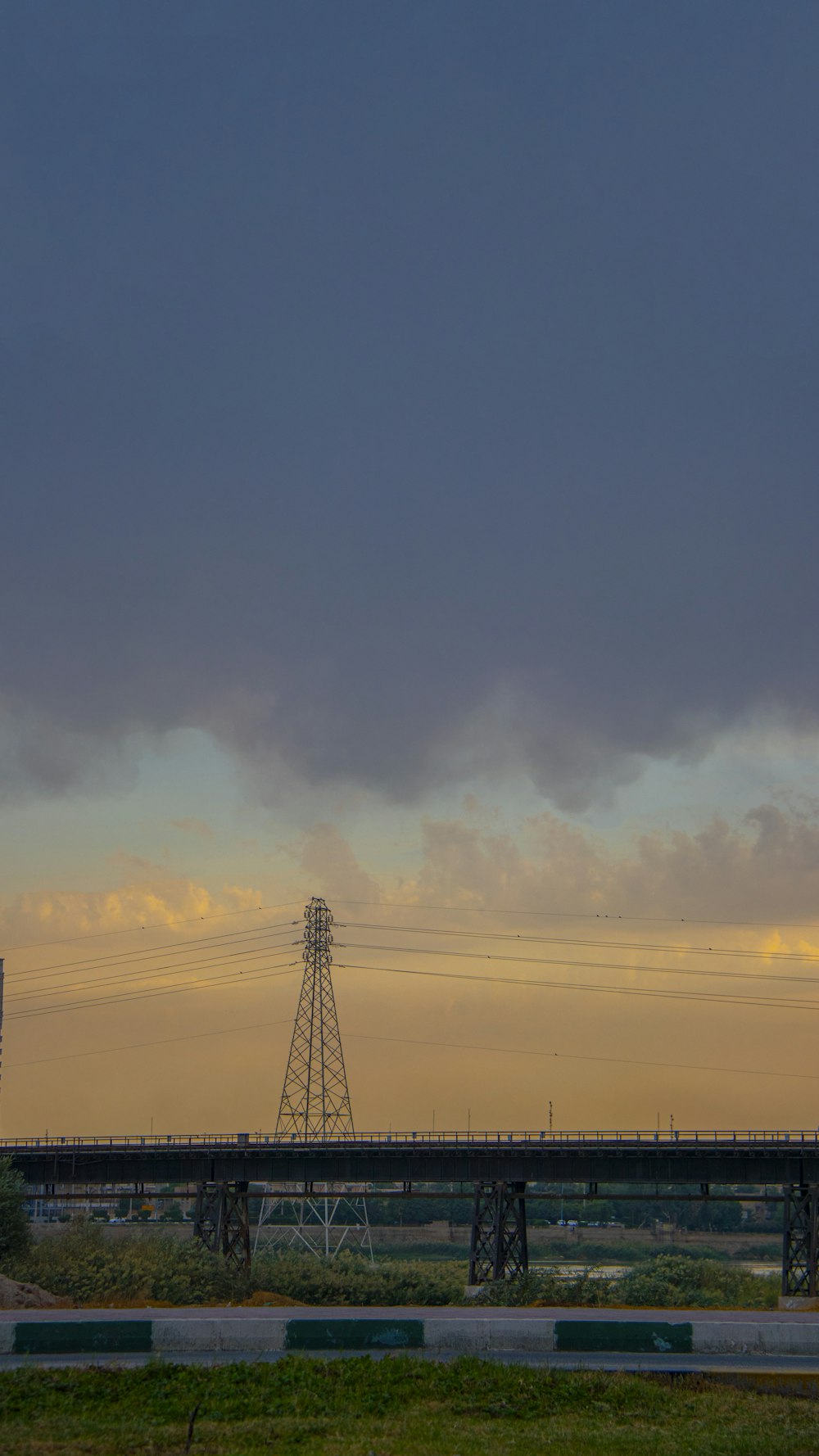 a bridge with a tower in the background