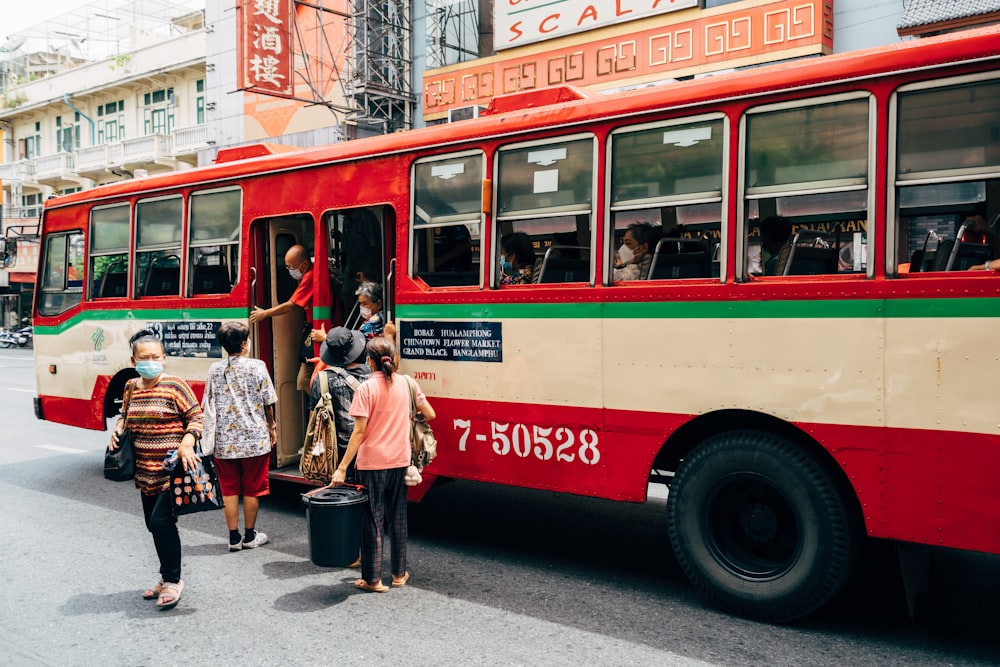 people boarding a bus