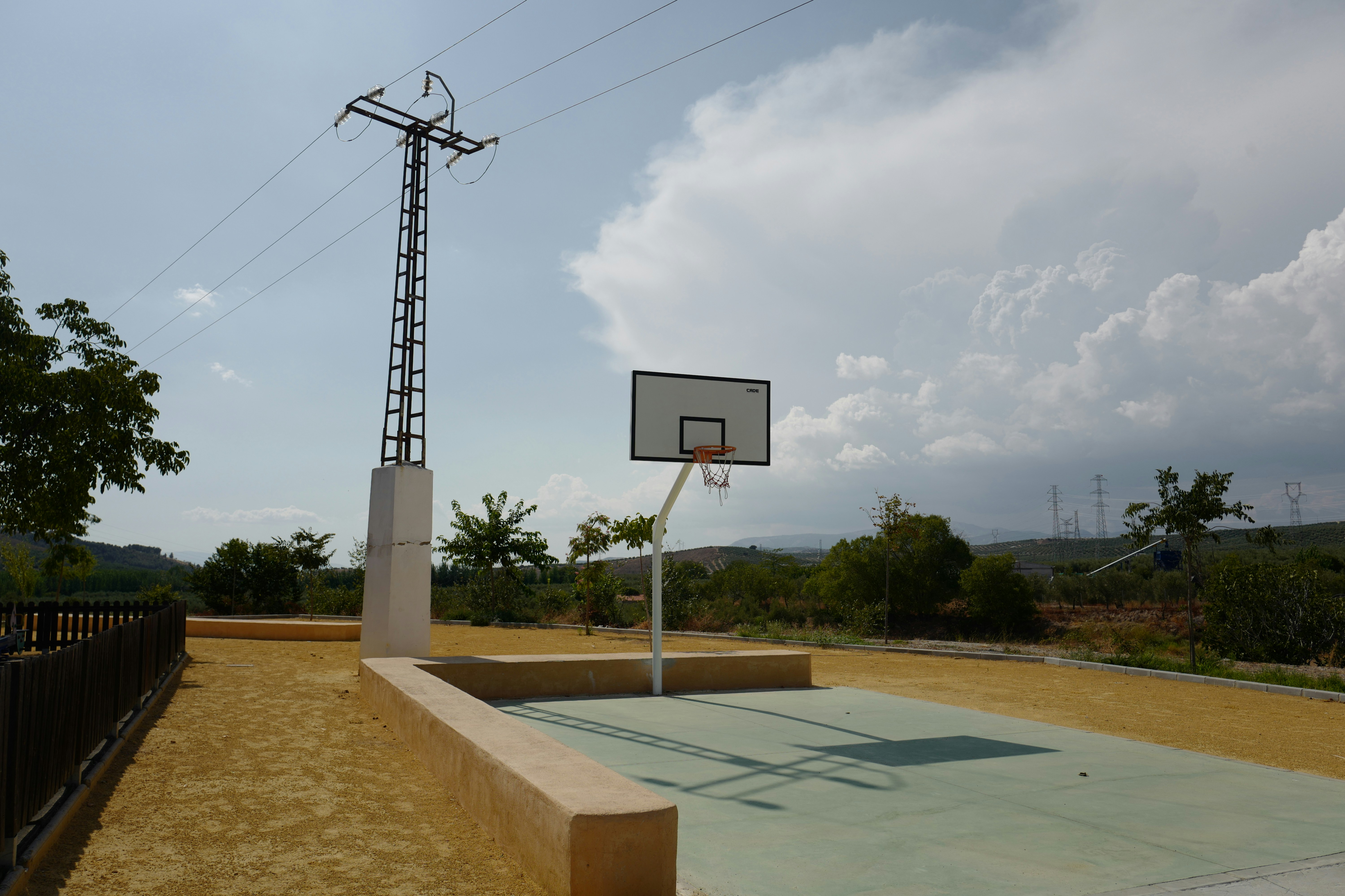 a basketball hoop in a park