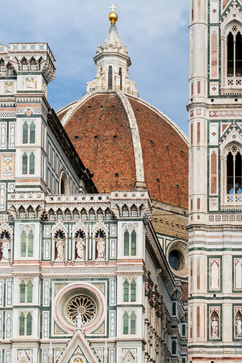 a large building with a domed roof with Florence Cathedral in the background