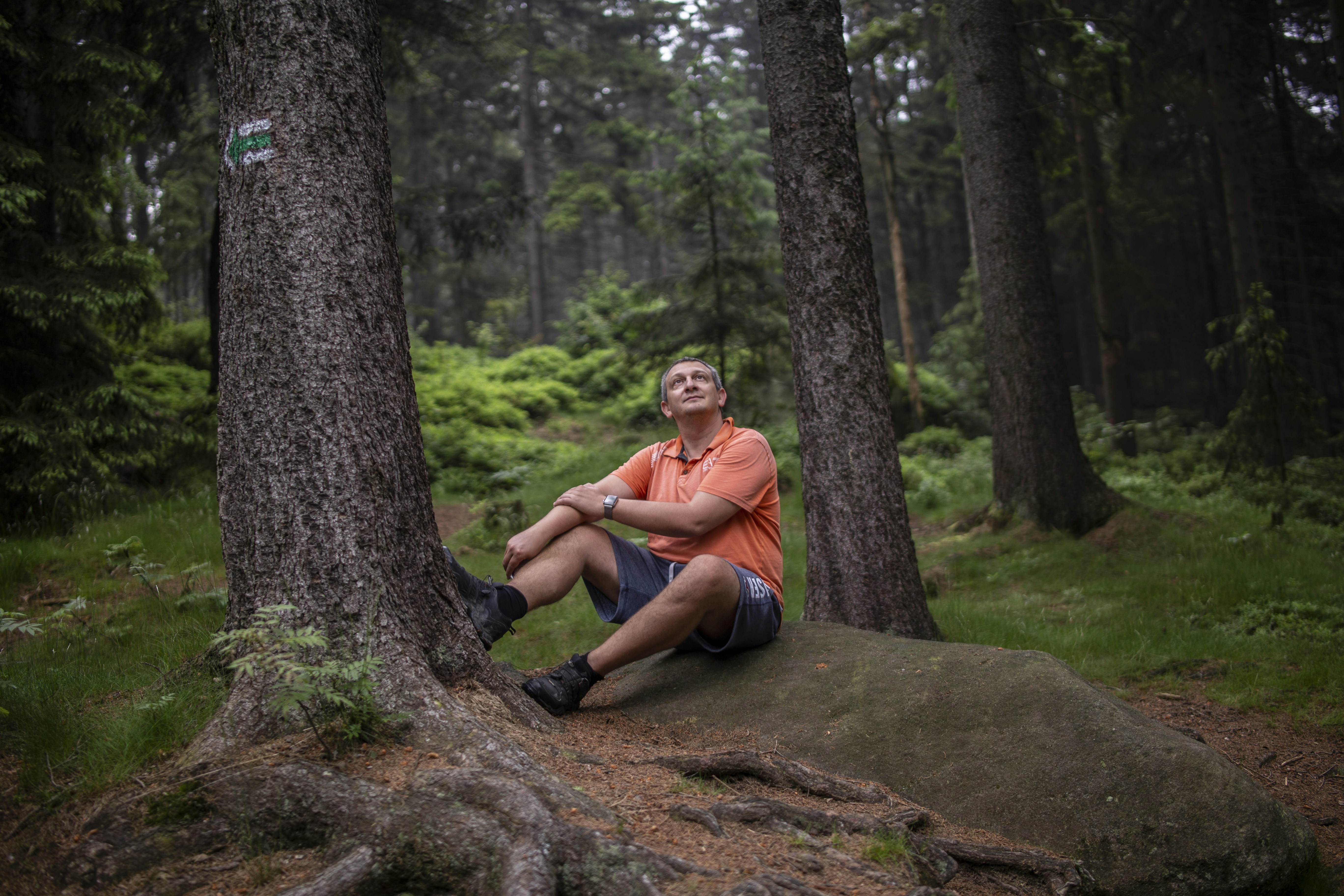 a man sitting on a rock