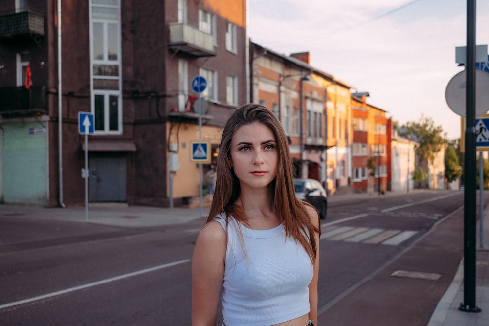 a woman standing on a street