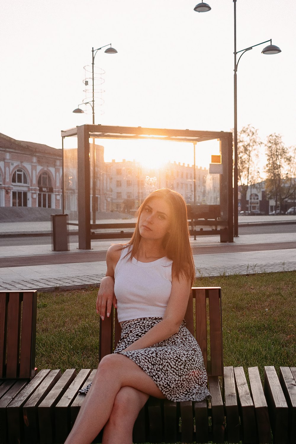 a woman sitting on a bench