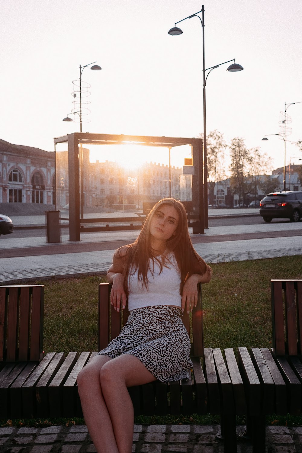 a woman sitting on a bench